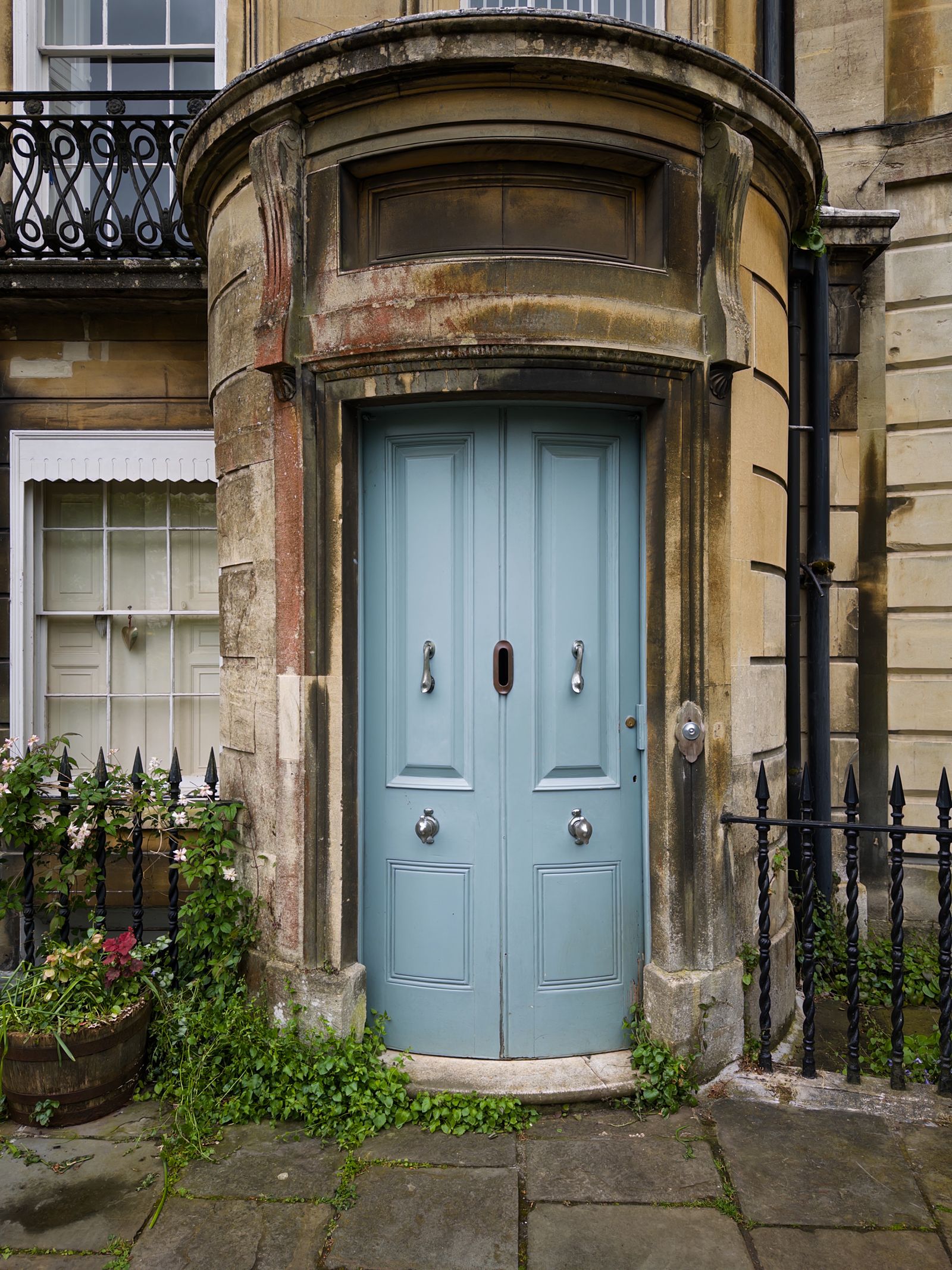 Elegant blue front door on a period stone property