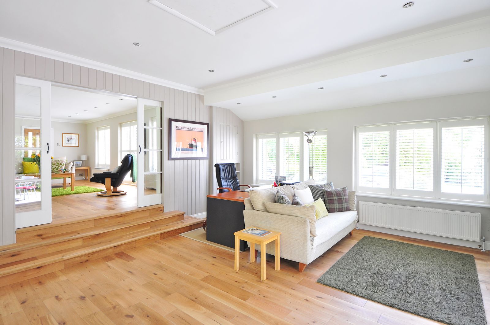 Bright living room with newly installed white framed windows