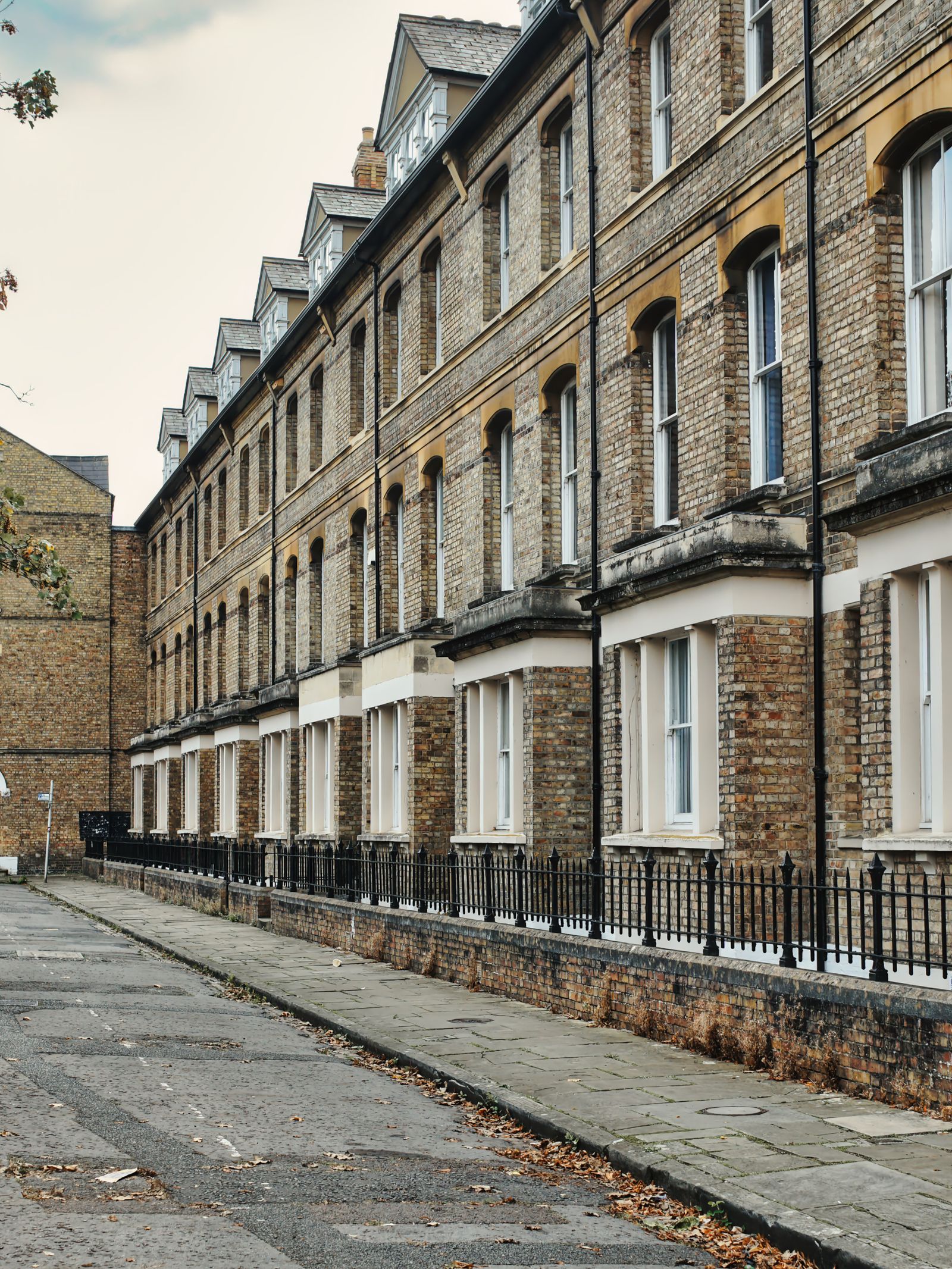 Victorian terraced houses with white framed sash windows in good repair